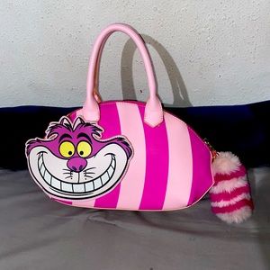 Disney Alice In Wonderland bag ! Eyes and smile glows in the dark!